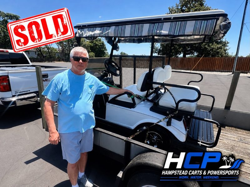 John from Hampstead standing beside his 2006 Club Car DS golf cart