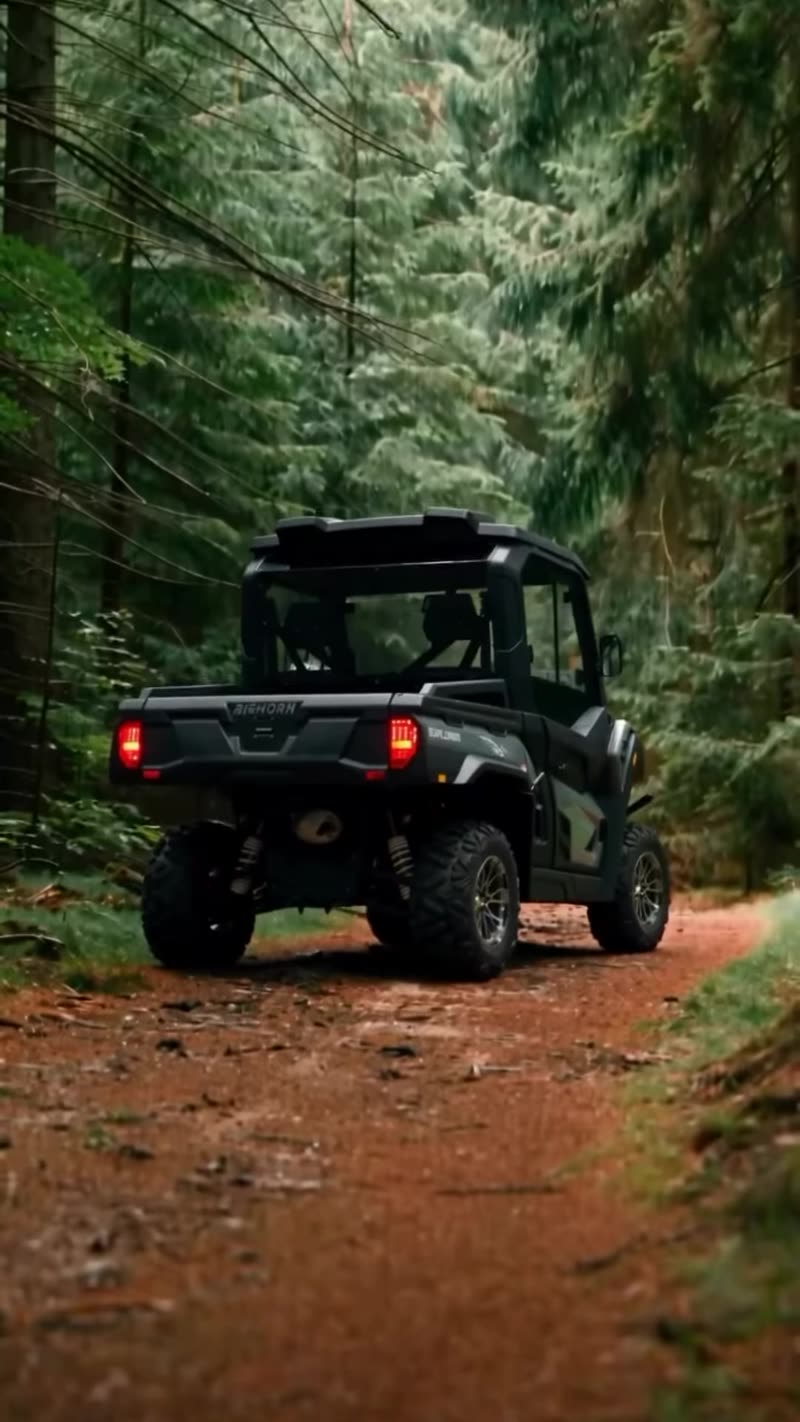 Bighorn UTV driving down a forest trail