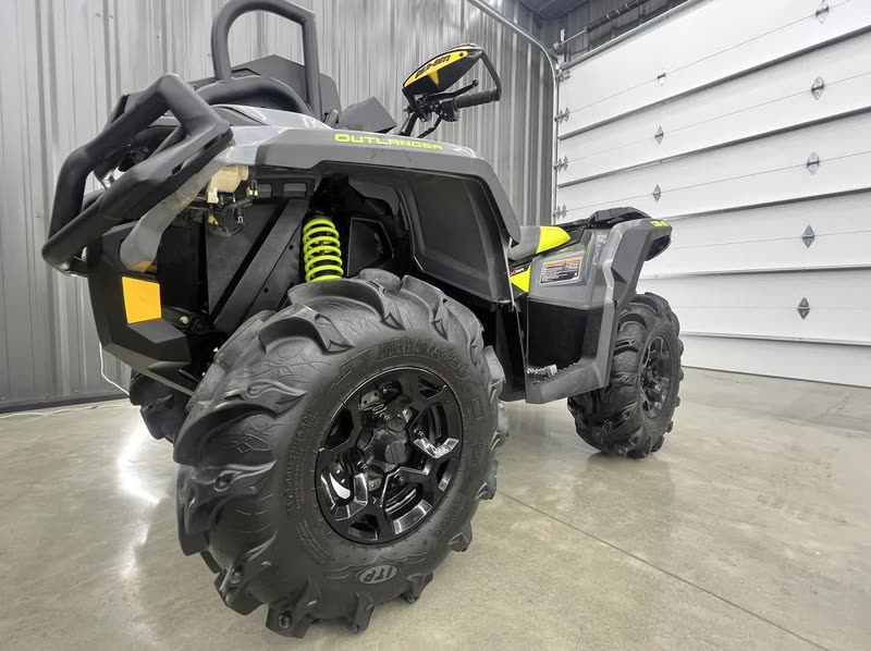 Can-Am Outlander XMR 650 mud ATV with lime green springs