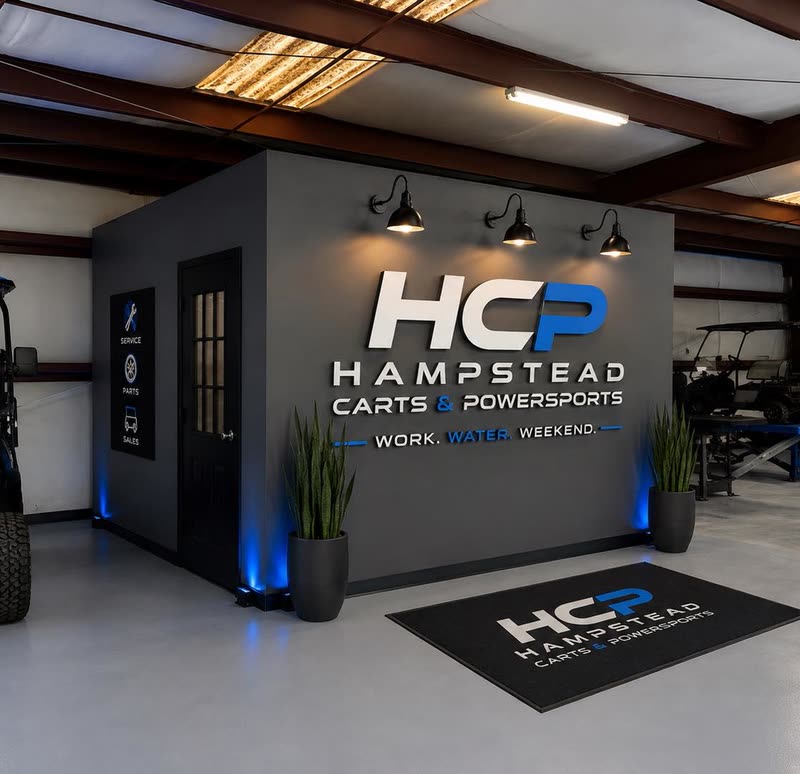 HCP lobby with the Hampstead Carts & Powersports logo wall