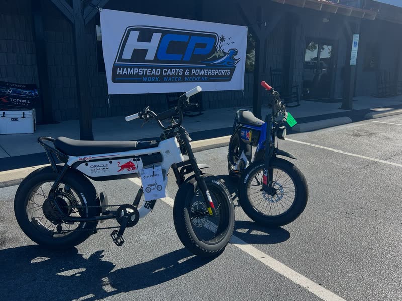 Red Bull and blue Super73 e-bikes under the HCP banner