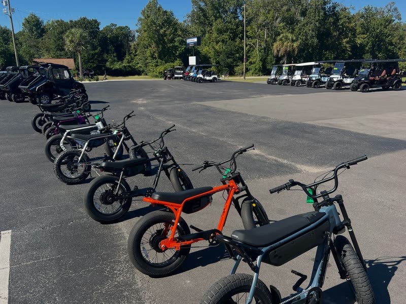 Orange, gray and black Super73 e-bikes lined up